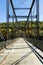 Pond Eddy, NY / United States - Oct. 10, 2015: A vertical image of the historic Pond Eddy Bridge, spanning the Delaware River in