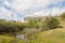 A pond full of life in front of the Ciudad Jardin residence, a modern building for the elderly in the city of Plasencia