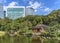 Pond of Hama-rikyÅ« Gardens reflecting in the water the buildings and a traditional Japanese teahouse.