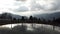 A pond in a mountain landscape, Italian Alps in a cloudy day