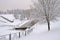 Pond of Olympic Village Park after heavy snowfall in winter, Moscow, Russia