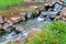 Pond and running water over waterfall