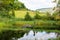 Pond with a sculpture of Loch Ness Monster Nessie in Drumnadrochit village in Scotland