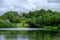 Pond and traditional house near the Admissions Hut into  Lyme Park, Disley in Cheshire, UK