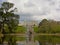 Pond with  trees in Powerscourt gardens, with castle in the background