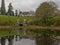 Pond with trees, winged horse statues and castle in Powerscourt garden, Enneskery