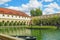 A pond in the Wallenstein Garden in Prague with a marble fountain with statues of Hercules and the Naiads.