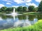 Pond with water fountain in small American neighborhood