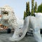 Ponorogo 12 September 2023White lion statue, two heads, legs, open mouth, teeth, green trees, morning light, blue and white sky