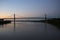 Pont d`Aquitaine bridge at sunset. It is a large suspension bridge over the Garonne, north-west of the city of Bordeaux, France