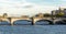 A Pont De la Concorde bridge across Seine river with a double decker tourist sightseeing bus, Paris