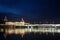 Pont de la Guillotiere bridge in Lyon, France over a panorama of the riverbank of the Rhone river Quais de Rhone at night