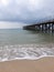 Pont to the sea sandy beach vloudy day mild water