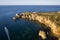 Ponta da Piedade lighthouse. Portuguese southern golden coast cliffs. Aerial view in Lagos in Algarve, Portugal