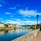 Ponte alle Grazie bridge on Arno river, sunset landscape. Florence or Firenze, Italy.