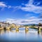 Ponte alle Grazie bridge on Arno river, sunset landscape. Florence or Firenze, Italy.