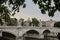 Ponte Principe Amedeo Savoia Aosta, between trees and in the background the dome of the Basilica of San Pedro, in Rome. Italy