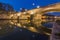 Ponte Sisto bridge and river Tiber at night on the shore and below the bridge