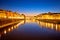 Ponte Vecchio bridge and Arno river waterfront in Florence evening view