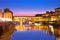 Ponte Vecchio bridge and Arno river waterfront in Florence evening view