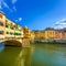 Ponte Vecchio landmark on sunset, old bridge, Arno river in Florence. Tuscany, Italy.