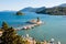 Pontikonisi and Vlacheraina monastery on Lake Chalikiopoulou seen from the hilltop of Kanoni on the island of Corfu, Greece.