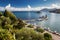 Pontikonisi and Vlacheraina Orthodox monastery seen from the hilltop of Kanoni on the island Corfu, Greece.