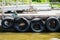 Pontoon with recycled old tyres used as boat bumpers.