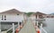 Pontoon walkway into raft house floating on the river