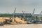 Pontoons in front of tanks on Long Tau River, Phuoc Khanh, Vietnam