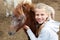 Pony and little girl and her best friend