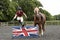 Pony rider jumping a low fence