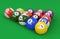 Pool ball pyramid on green background