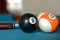 Pool balls cues and a ball rack