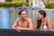 Pool couple relaxing on luxury resort travel holiday talking tog