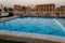 Pool deck and parasols of luxury boat cruise ship in egypt luxor during dawn sunset