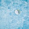 Pool float for children, ring floating in a refreshing blue pool