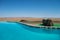 Pool with Hippo Sculpture in a Desert Landscape in Namibia