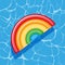 Pool infantable rainbow mattress place on water texture.