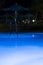 Pool lighting in backyard at night for family lifestyle and living area. Luxury design with good light and clean landscaping. pool