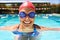 The pool is like a second home. Closeup portrait of a female swimmer treading water in a swimming pool.