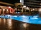 Pool at night at hotel building