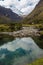 Pool reflecting mountains, on Stream from the glaciers of Huascaran mountains, on Huaraz