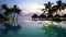 Pool vacation travel destination - beach, palm trees overwater bungalow hotel