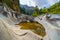 Pool of water trapped between the eroded rocks of the mountainous valley.