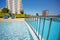 Pools, poolside with deck-chairs and umbrellas