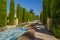 Pools, summer blooms and towering Cypress trees in Cordoba, Spain