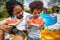 Poolside Bonding: Father and Son Enjoying Watermelon