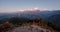 Poonhill view of Annapurnas. Warm pink and orange sunrise light over Annapurna mountain range with blue sky and beautiful clouds