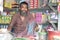 Poor asian food shop owner selling betel leaf